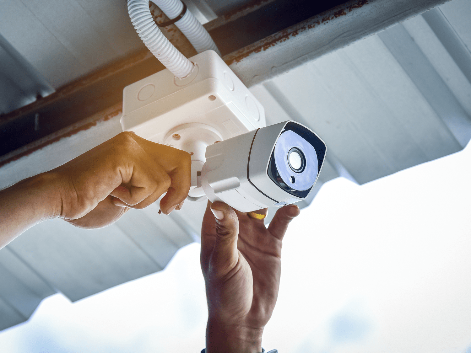 Technician Installing Security Camera